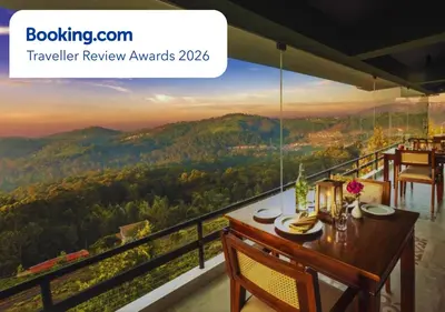 a dining room with a view of the mountains at Sleeping Beauty by Nature Resorts and Stays in Coonoor