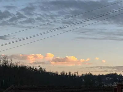a view of a cloudy sky at sunset at REHMANS HOMESTAY in Ooty