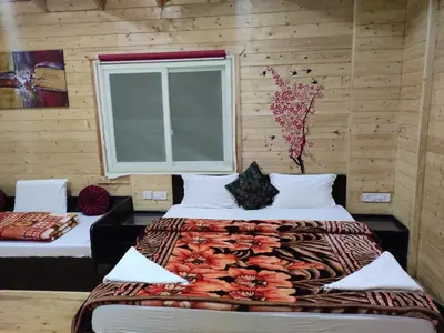 a bedroom with two beds and a window at The Laughing Woods AC Resort in Kotagiri