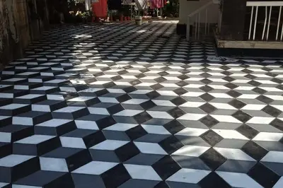 a black and white checkered floor on a street at Ocean Pearl in Kozhikode