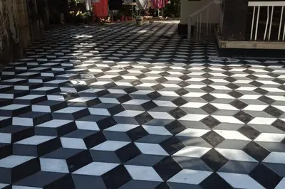 a black and white checkered floor on a street at Ocean Pearl in Kozhikode