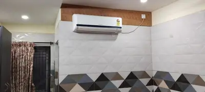 a bathroom with a air conditioner on a wall at SAMPATH RESIDENCY in Palani